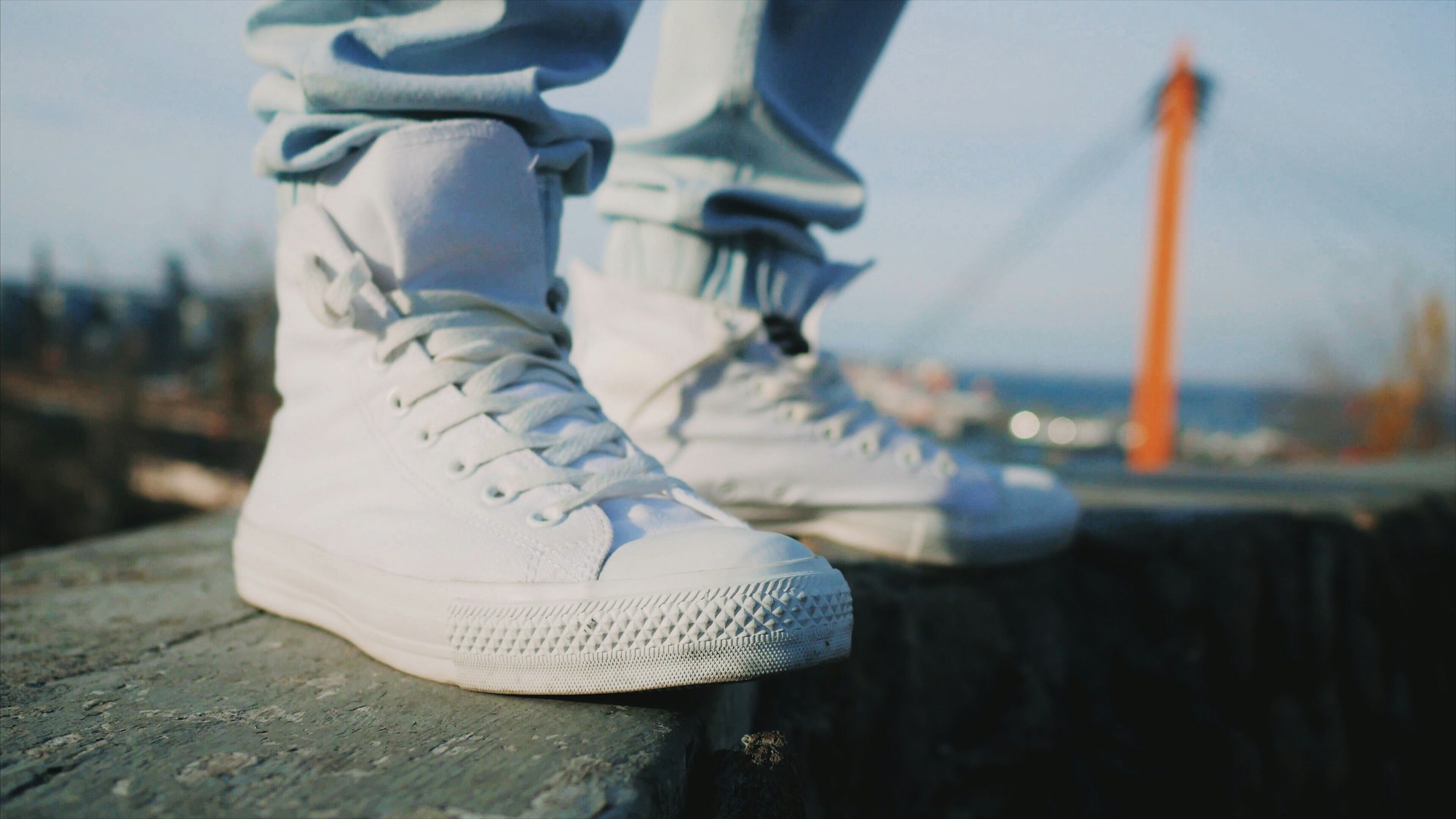 White sneakers . Man in high top shoes outdoors